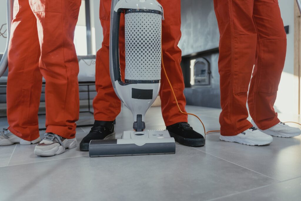 people wearing sneakers and a vacuum